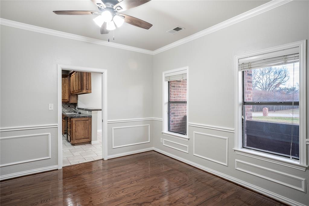 250 Timberleaf Drive Double Oak, TX 75077 - Photo 10 of 23 wooden floor in an empty room with a window