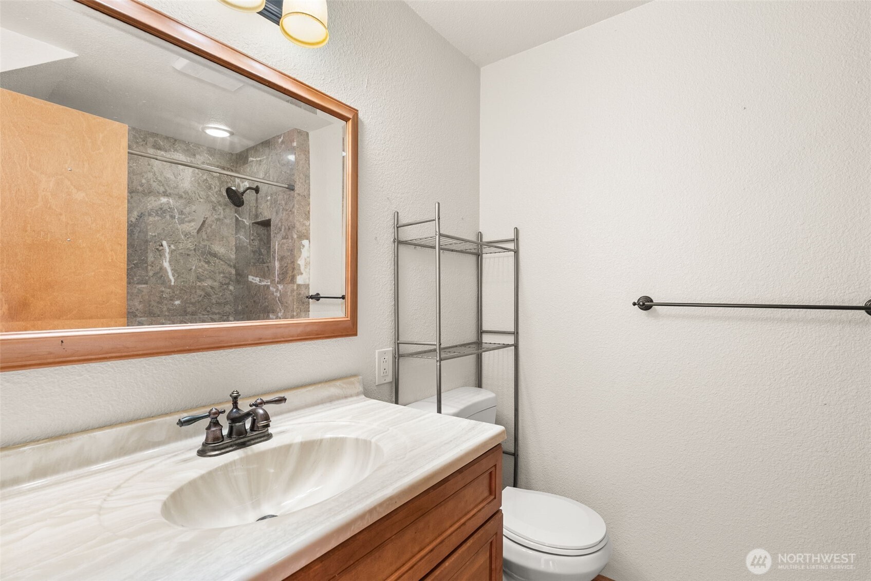 802 State Street Centralia, WA 98531 - Photo 12 of 40 a bathroom with a sink toilet vanity and shower