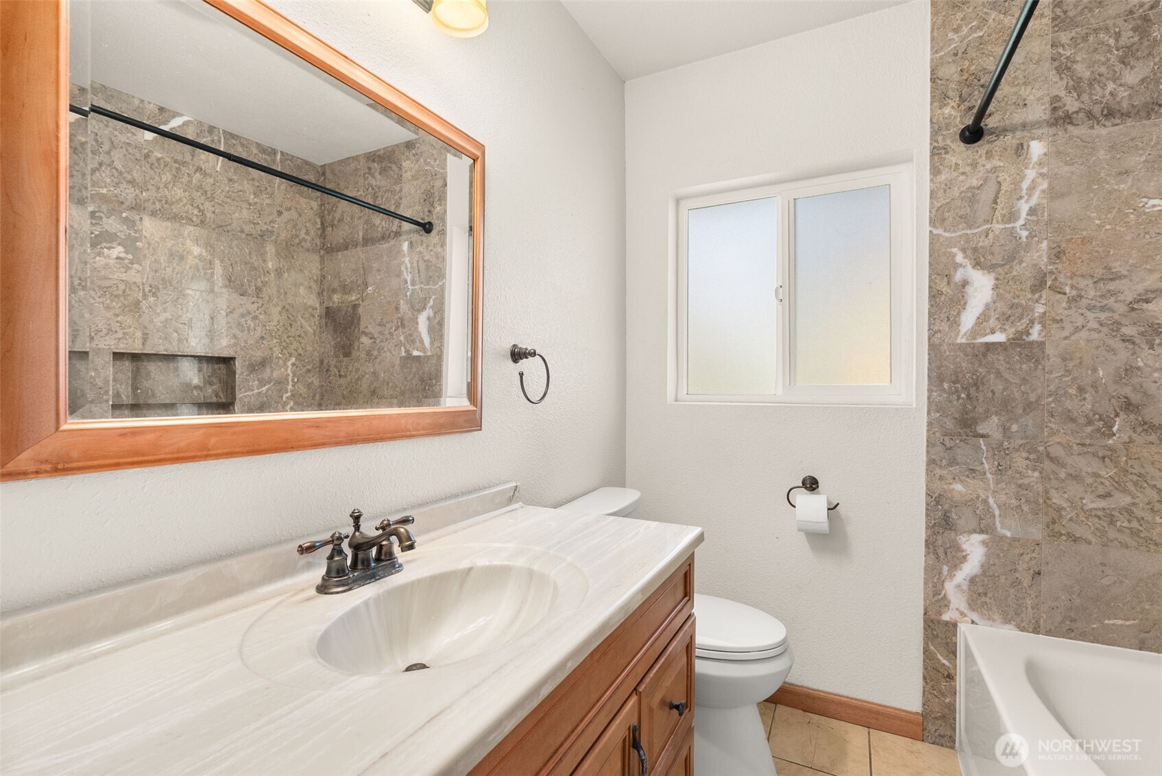 802 State Street Centralia, WA 98531 - Photo 14 of 40 a bathroom with a sink toilet and mirror