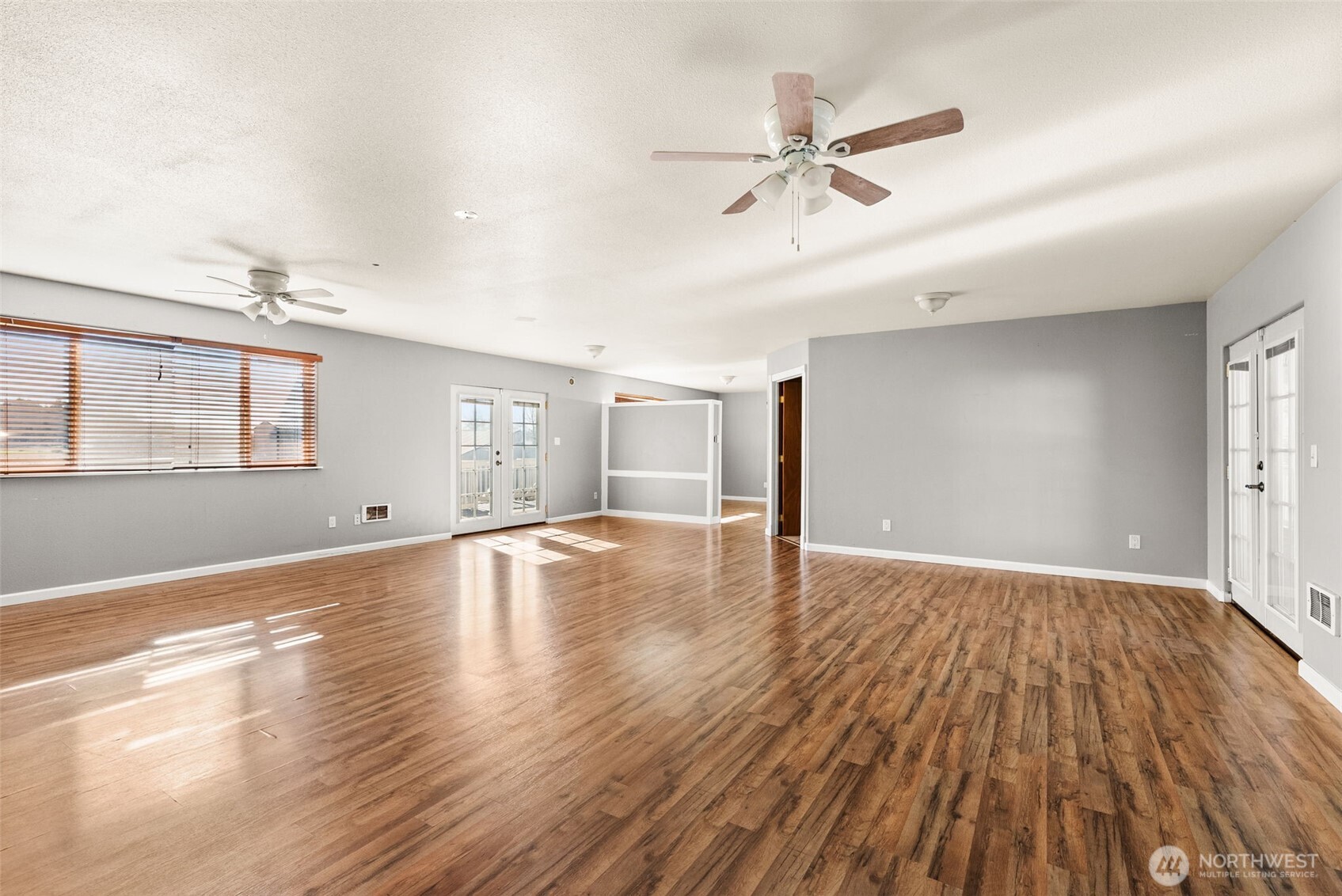 802 State Street Centralia, WA 98531 - Photo 15 of 40 a view of empty room with wooden floor and fan