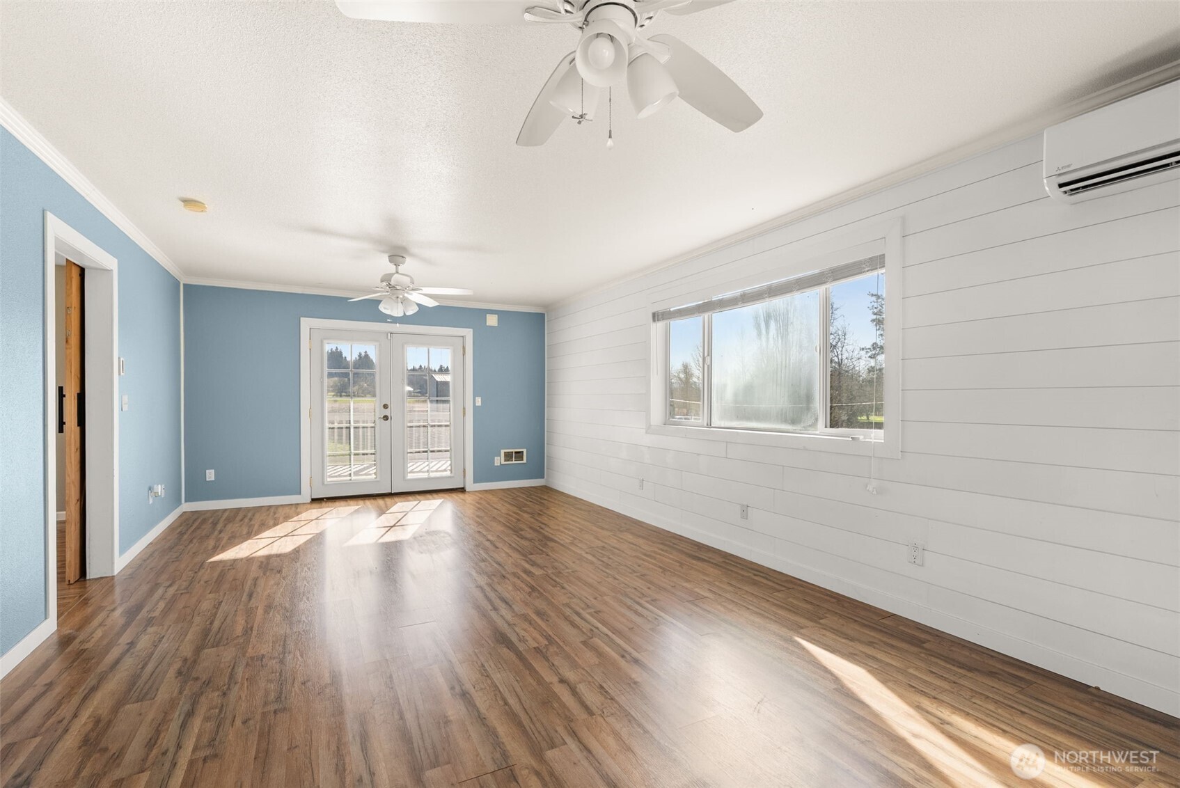 802 State Street Centralia, WA 98531 - Photo 25 of 40 wooden floor in an empty room with a window