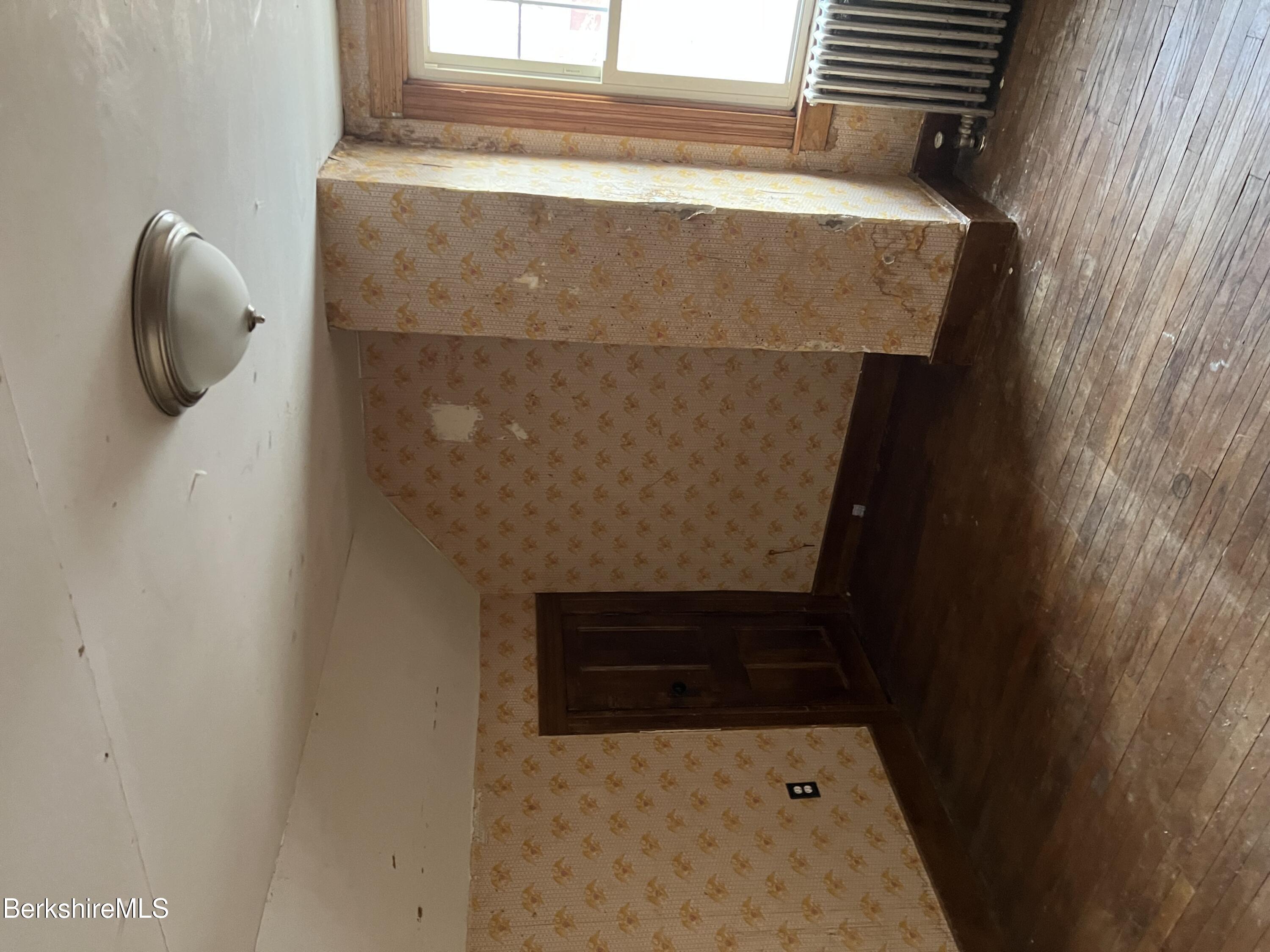 41 Willow Street Adams, MA 01220 - Photo 16 of 25 an empty room with wooden floor and windows