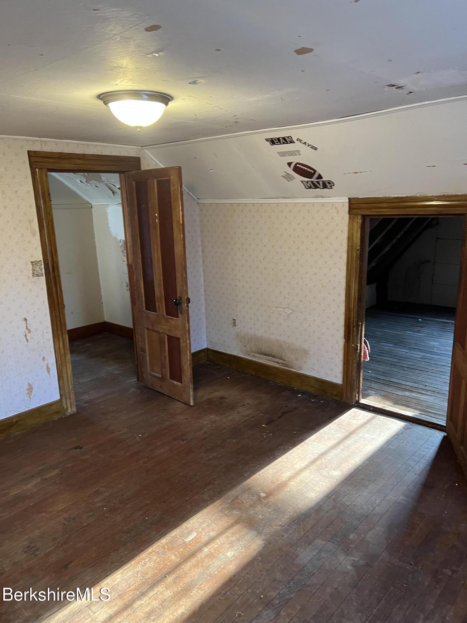 41 Willow Street Adams, MA 01220 - Photo 17 of 25 a view of a livingroom with a staircase