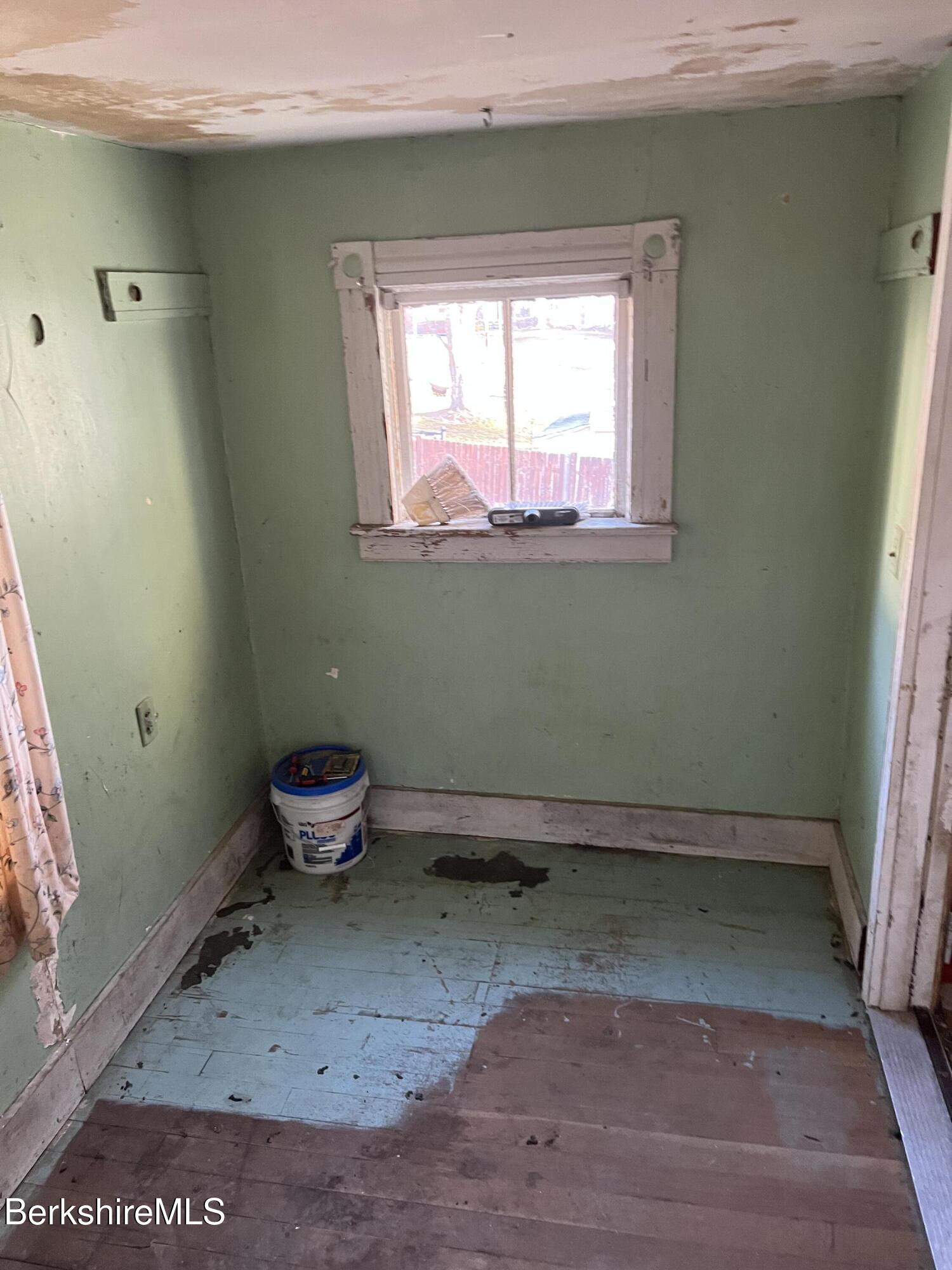 41 Willow Street Adams, MA 01220 - Photo 4 of 25 a room with a wooden floor and a window