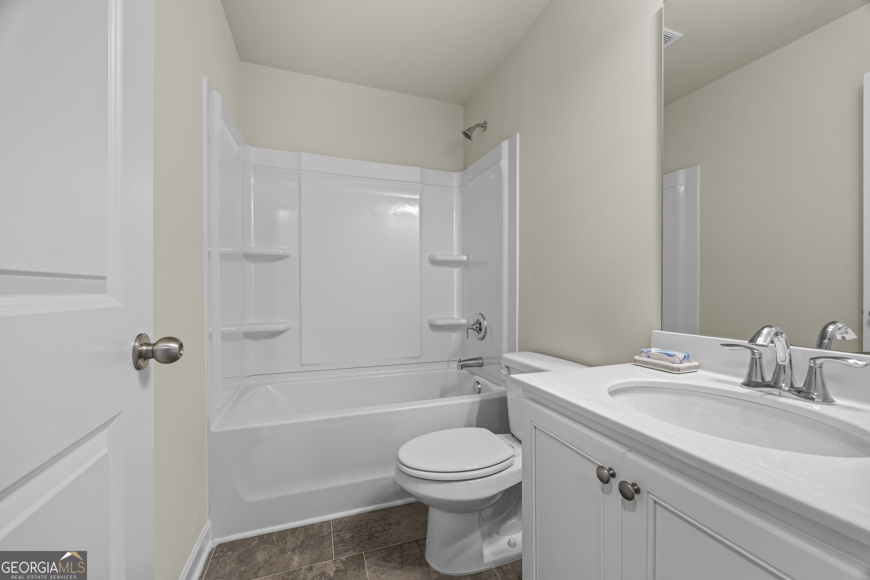 550 Buxton Road Hoschton, GA 30548 - Photo 32 of 57 a bathroom with a sink a toilet and shower