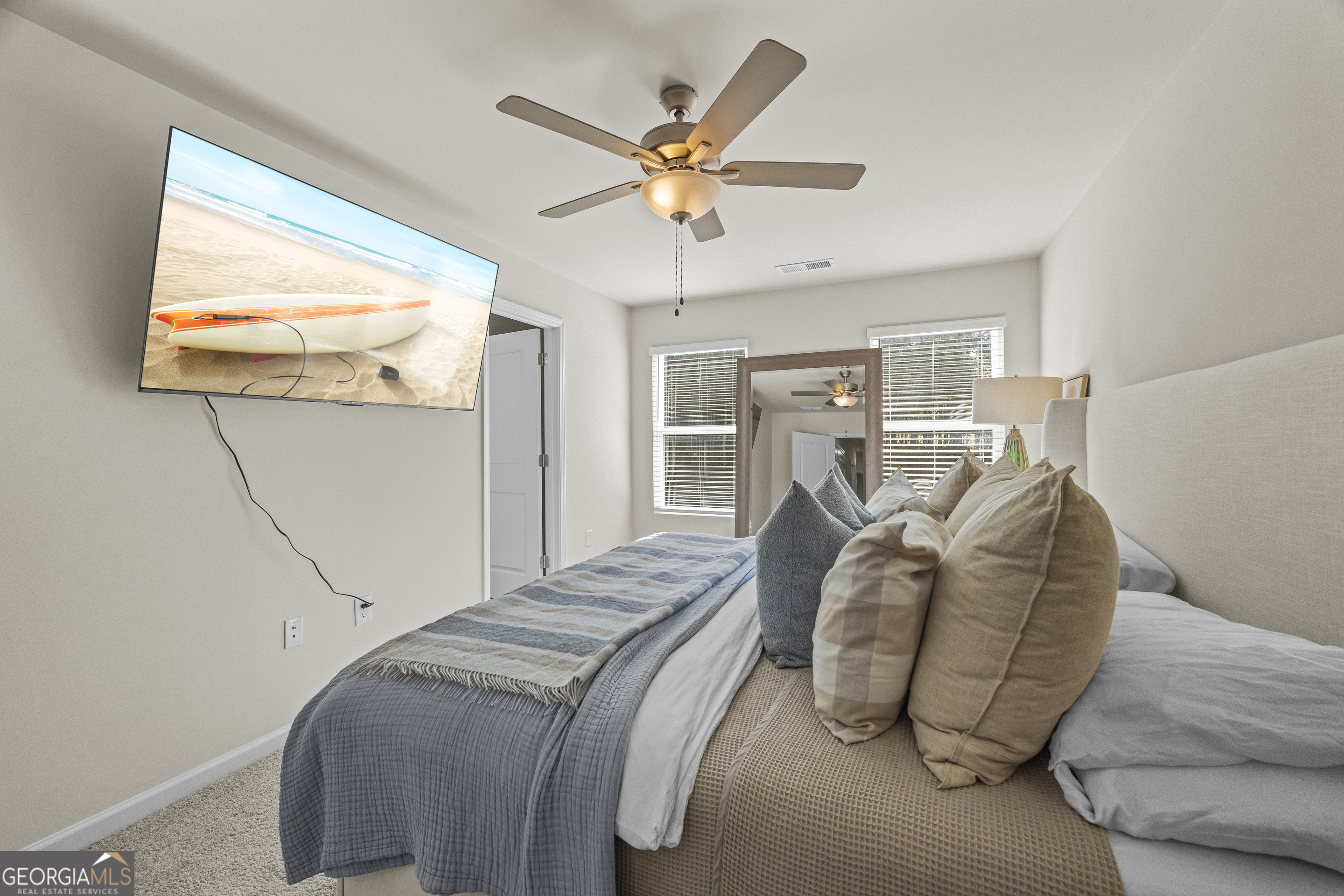 550 Buxton Road Hoschton, GA 30548 - Photo 37 of 57 a bed room with a bed and a ceiling fan