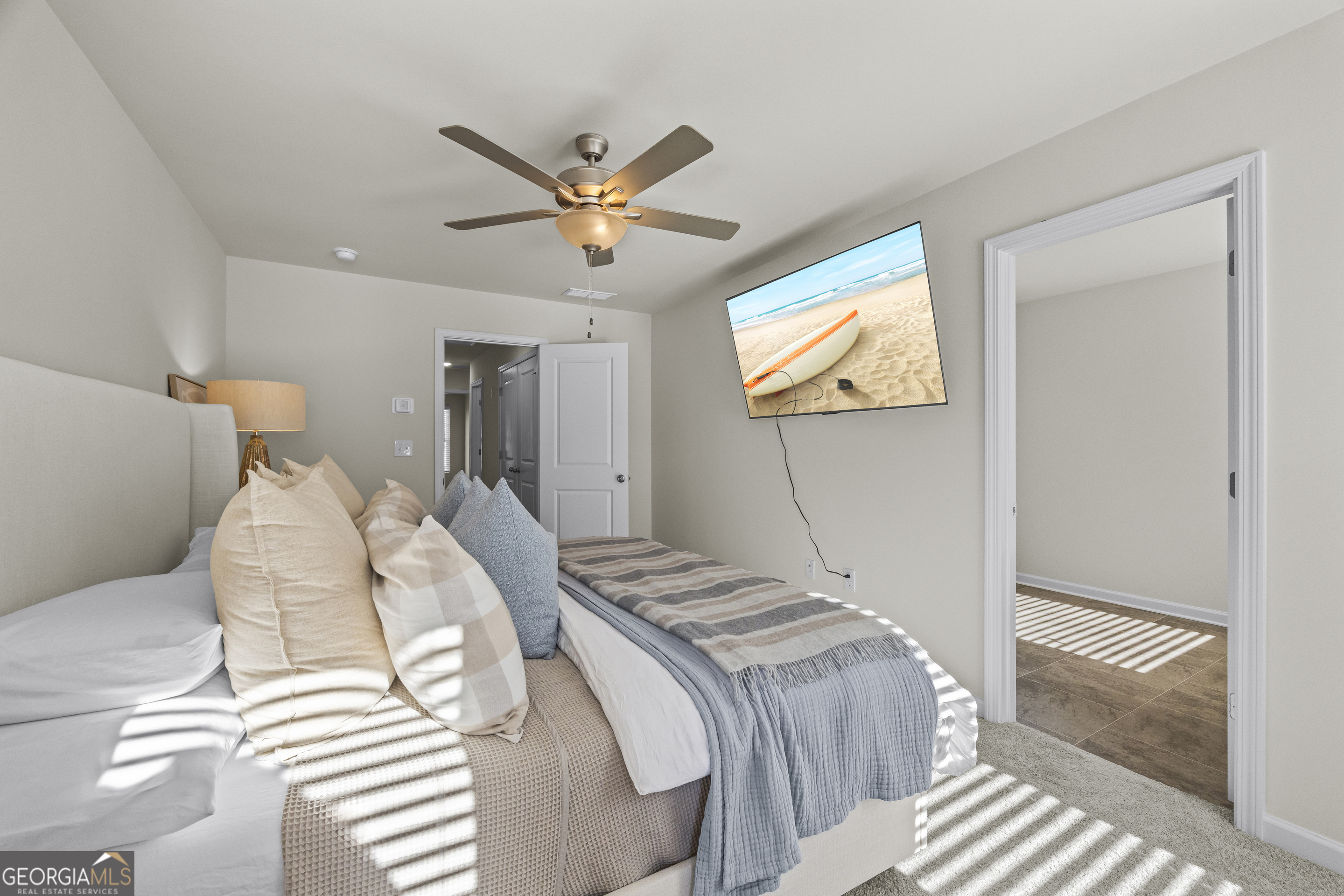 550 Buxton Road Hoschton, GA 30548 - Photo 39 of 57 a bedroom with a bed and a window