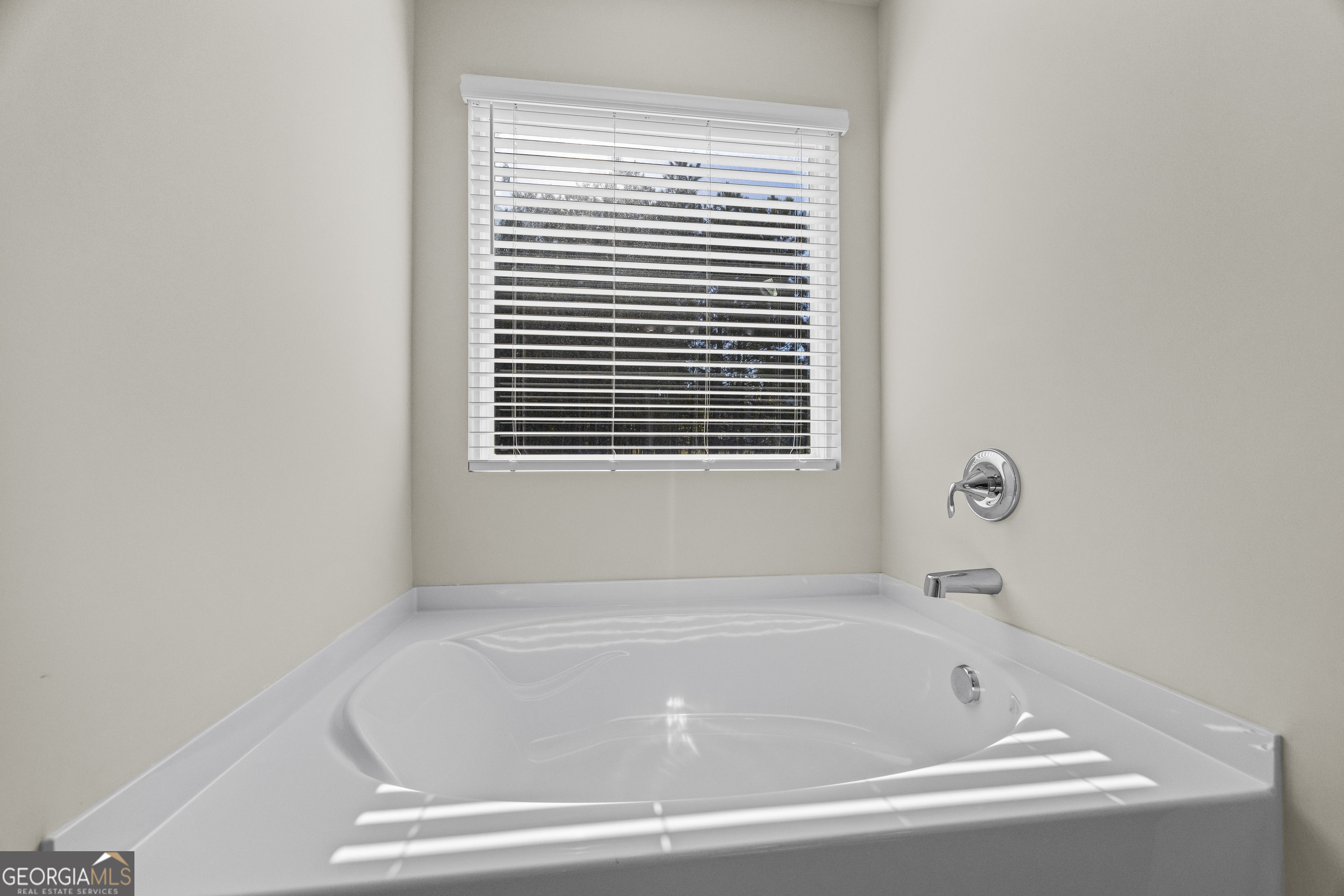 550 Buxton Road Hoschton, GA 30548 - Photo 44 of 57 a white bath tub sitting next to a window
