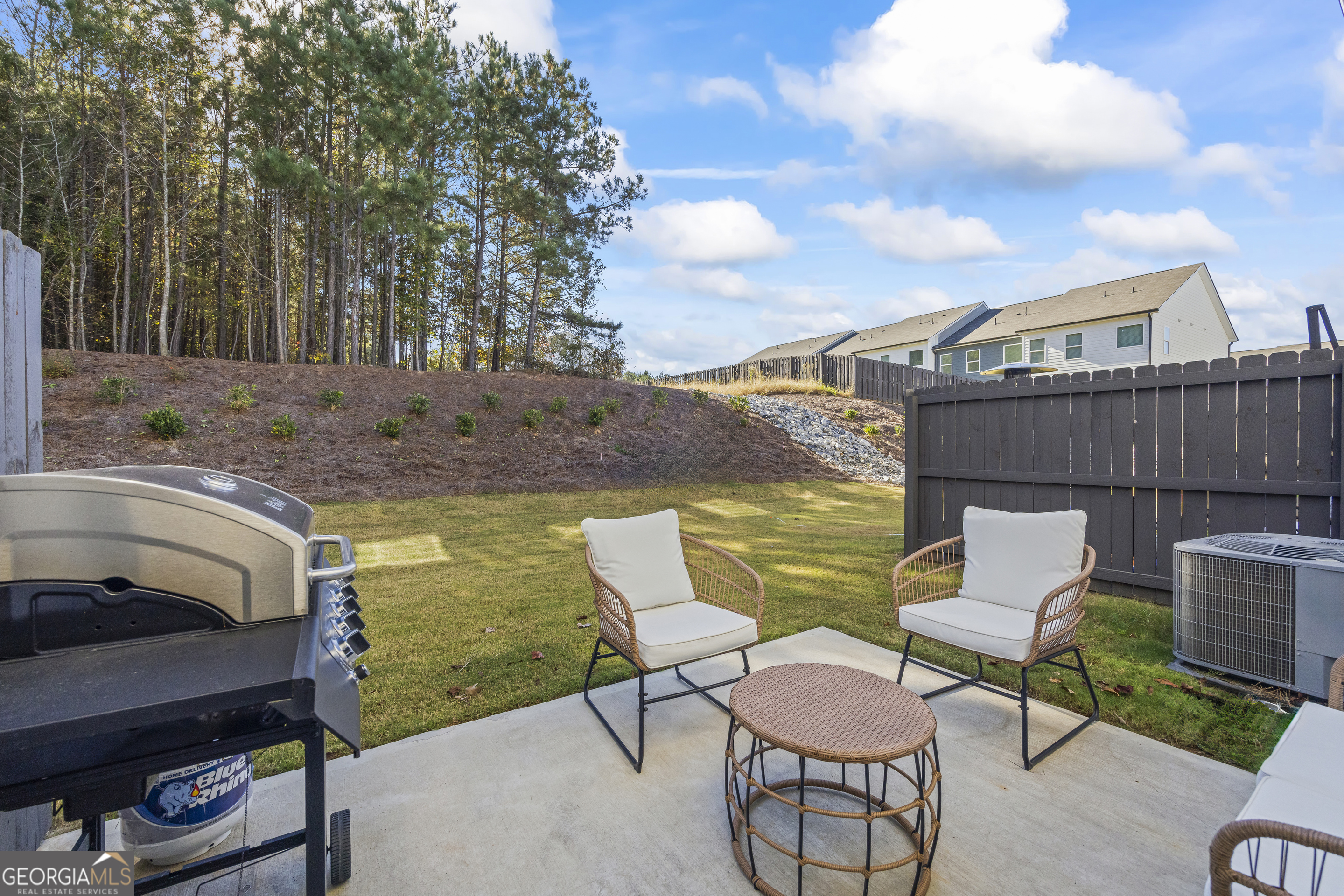 550 Buxton Road Hoschton, GA 30548 - Photo 49 of 57 a view of a chairs and table in the patio
