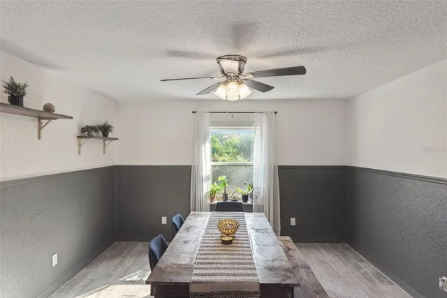 a kitchen with kitchen island a counter top space appliances and cabinets