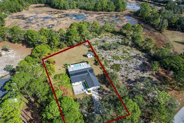 a view of a lake with a yard