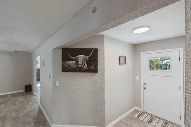 a living room with furniture and a large mirror
