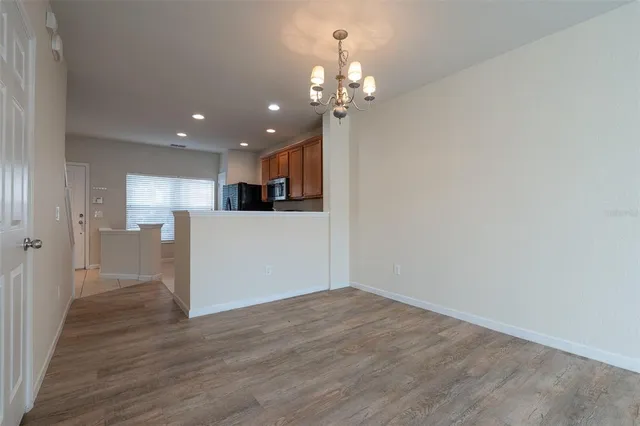 a view of a kitchen with a dishwasher cabinets and wooden floor