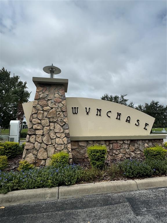 4900 Southwest 45th Street Ocala, FL 34474 - Photo 3 of 44 a view of a building with a yard and a bench