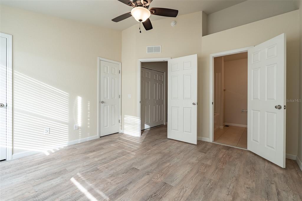 4900 Southwest 45th Street Ocala, FL 34474 - Photo 34 of 44 a view of an empty room with wooden floor