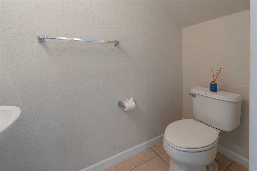 4900 Southwest 45th Street Ocala, FL 34474 - Photo 40 of 44 a white toilet sitting next to a shower