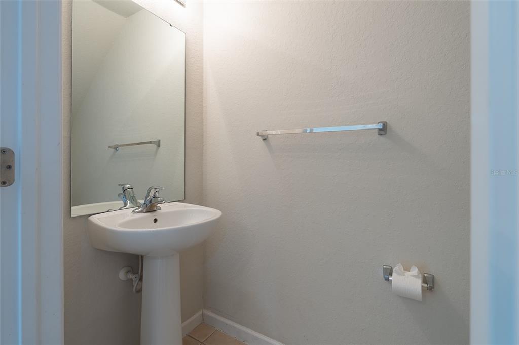 4900 Southwest 45th Street Ocala, FL 34474 - Photo 41 of 44 a bathroom with a sink a mirror and a window