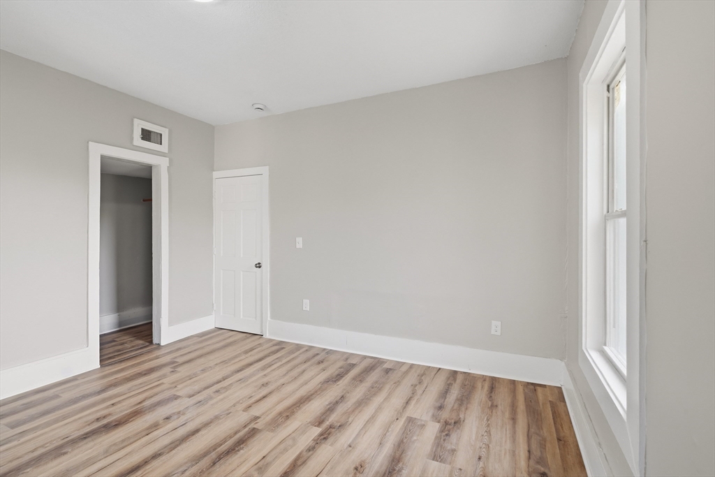 834 Worthington Street, Unit 2 Springfield, MA 01105 - Photo 10 of 20 a view of an empty room with wooden floor and closet