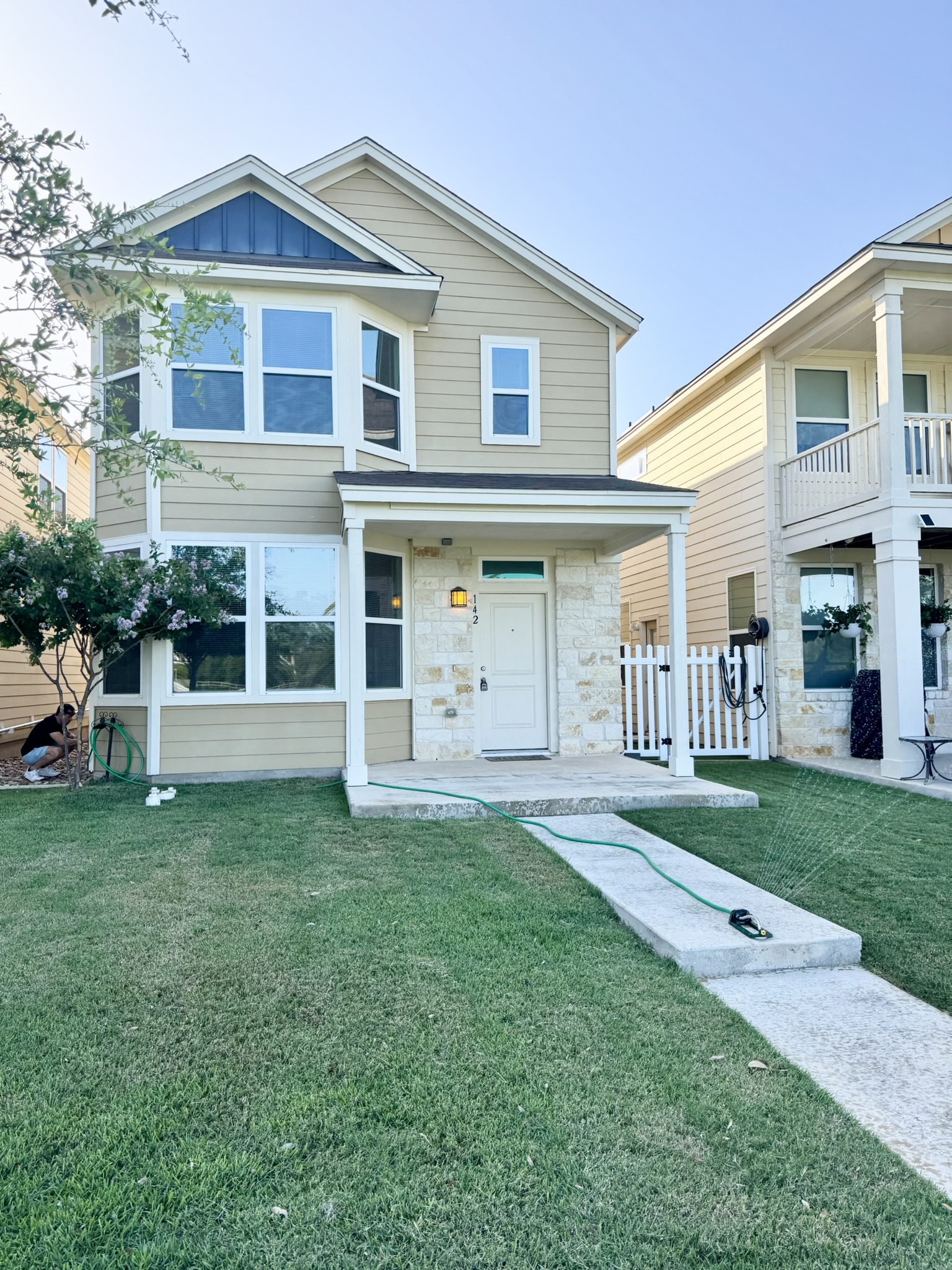 a front view of a house with a yard
