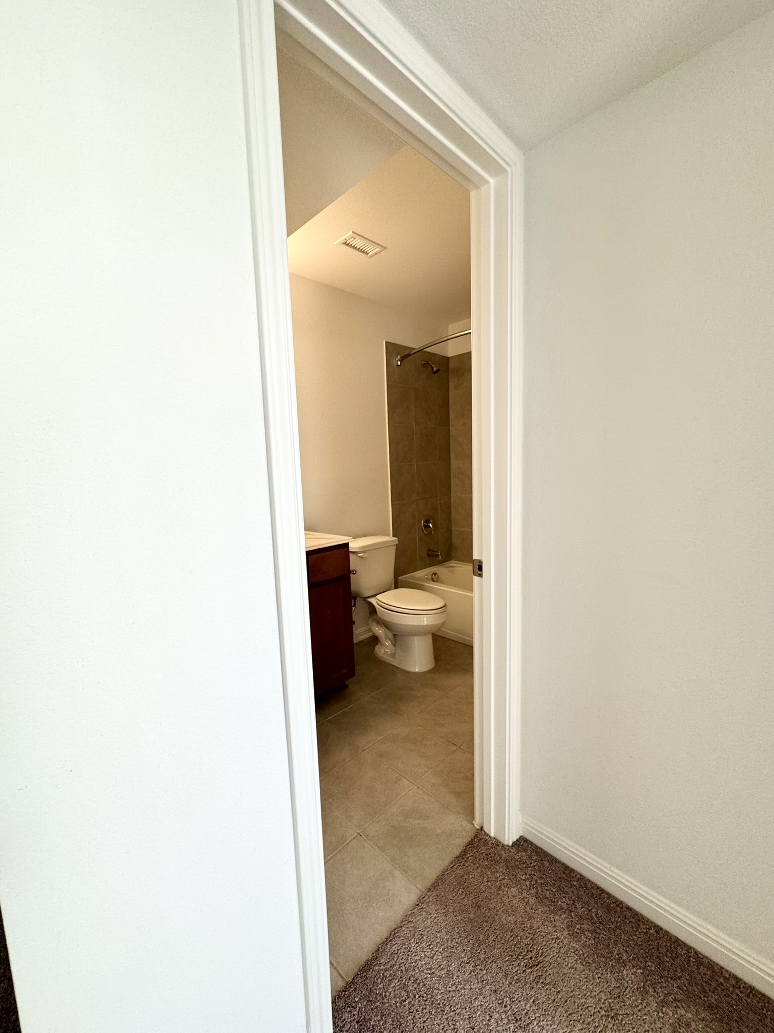211 Martha Lane Kyle, TX 78640 - Photo 13 of 32 a view of a bedroom from a hallway