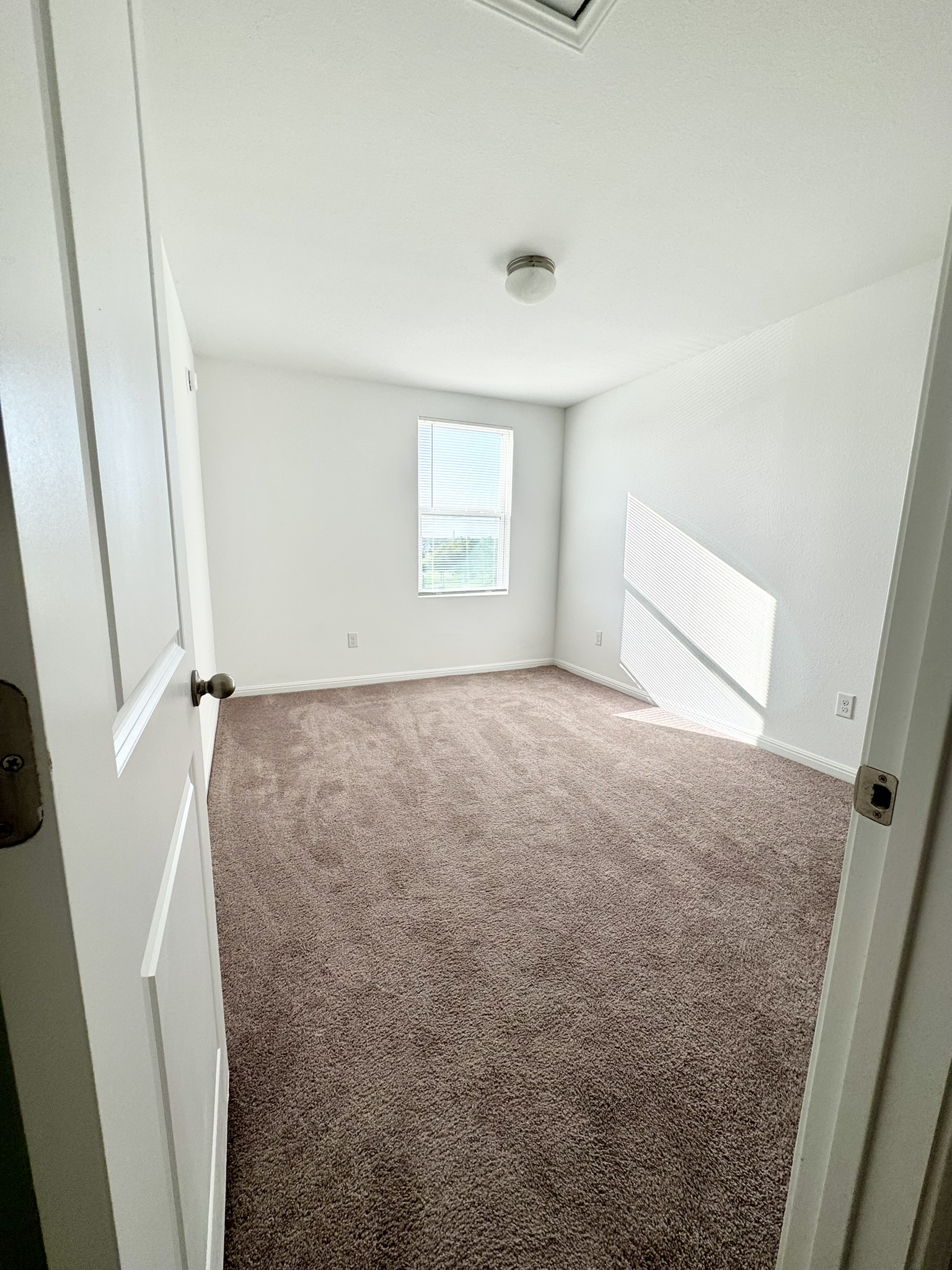 211 Martha Lane Kyle, TX 78640 - Photo 18 of 32 a view of a room that has a window