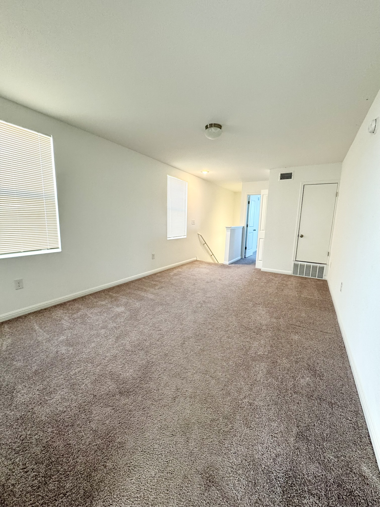 211 Martha Lane Kyle, TX 78640 - Photo 20 of 32 a view of a big room with windows and cabinet