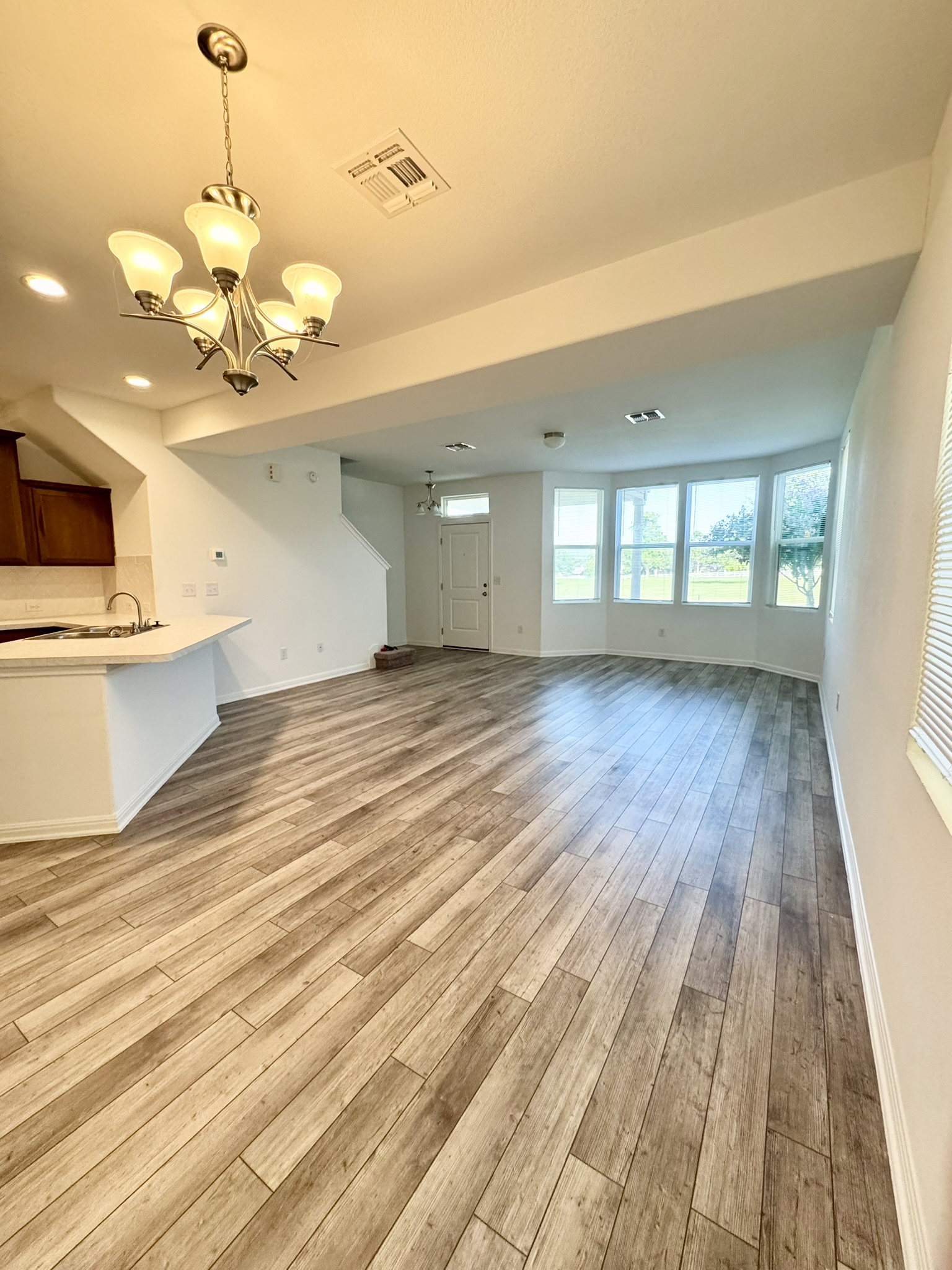211 Martha Lane Kyle, TX 78640 - Photo 2 of 32 a view of an empty room and window