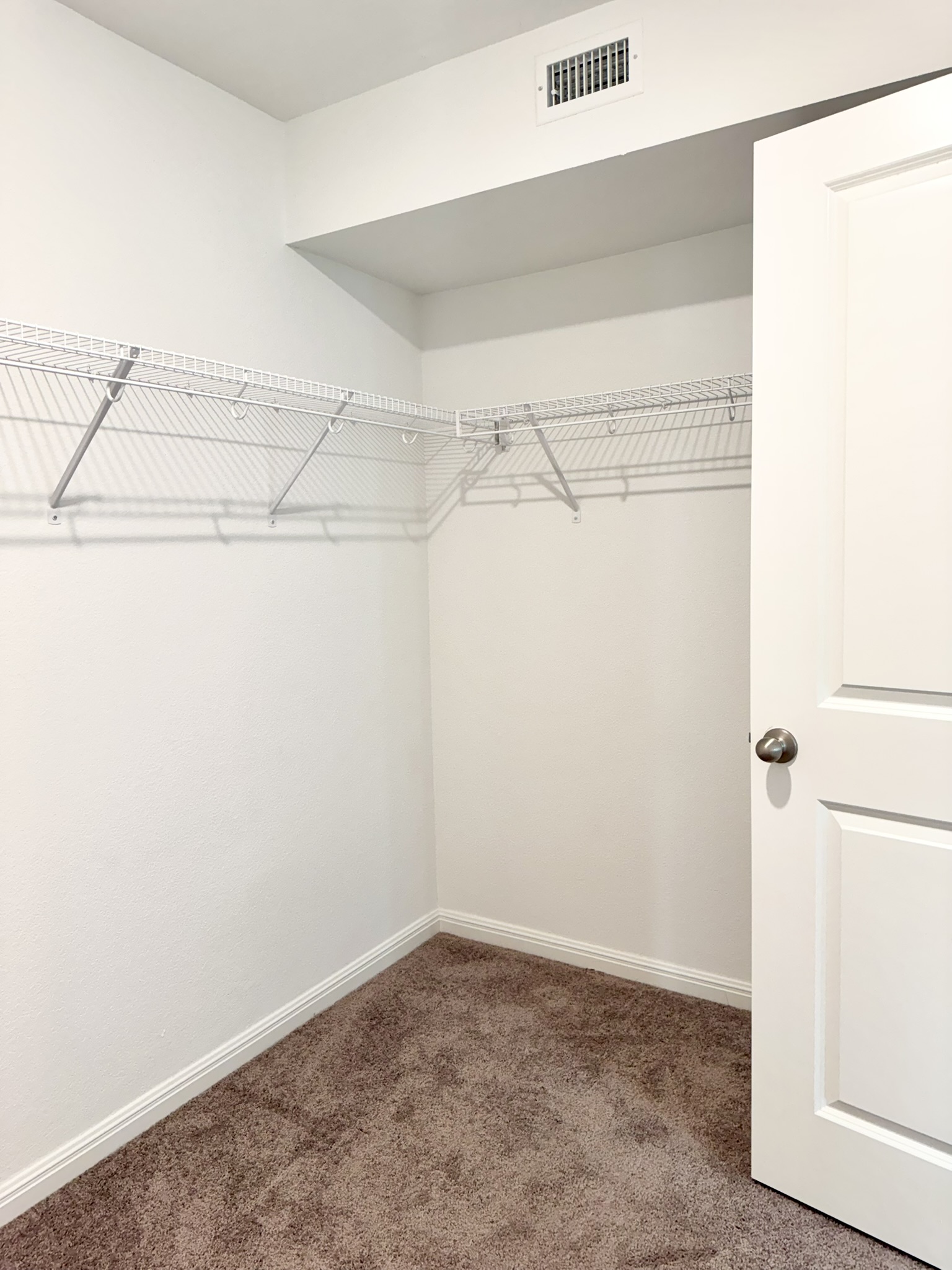 211 Martha Lane Kyle, TX 78640 - Photo 28 of 32 a view of a room with racks on the wall