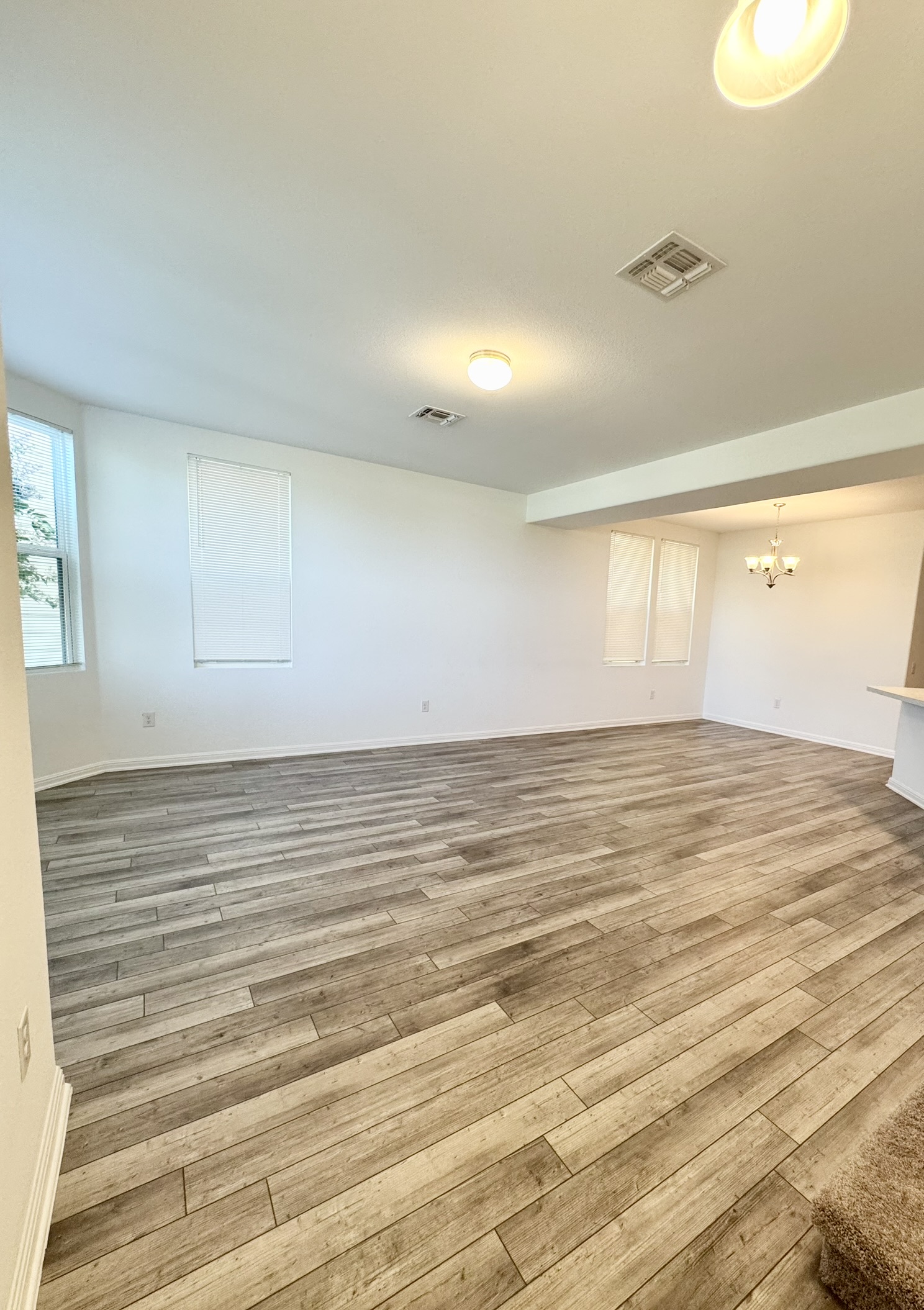211 Martha Lane Kyle, TX 78640 - Photo 3 of 32 a view of empty room with wooden floor