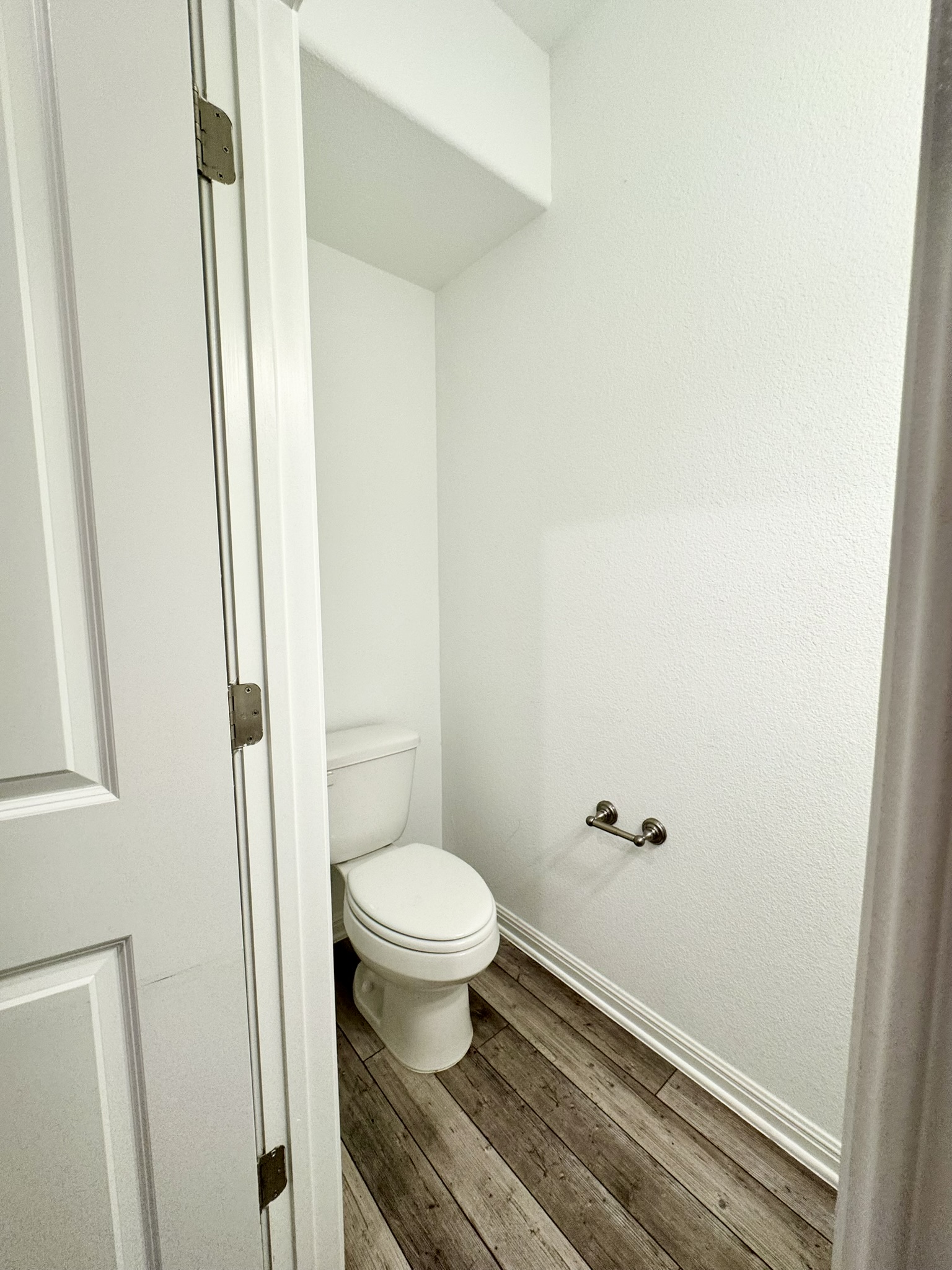 211 Martha Lane Kyle, TX 78640 - Photo 7 of 32 a bathroom with a toilet and a sink