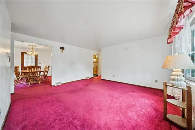 a view of a room with cabinet and a lamp