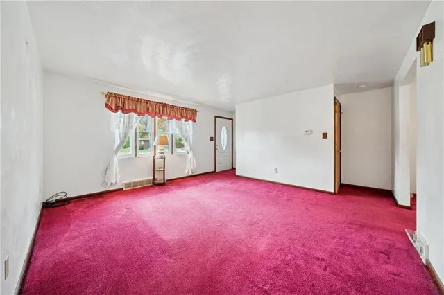 a bathroom with a sink a toilet and a shower