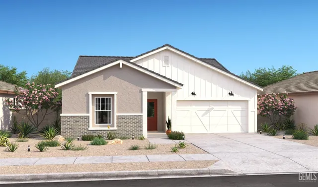 a view of a house with a yard and garage