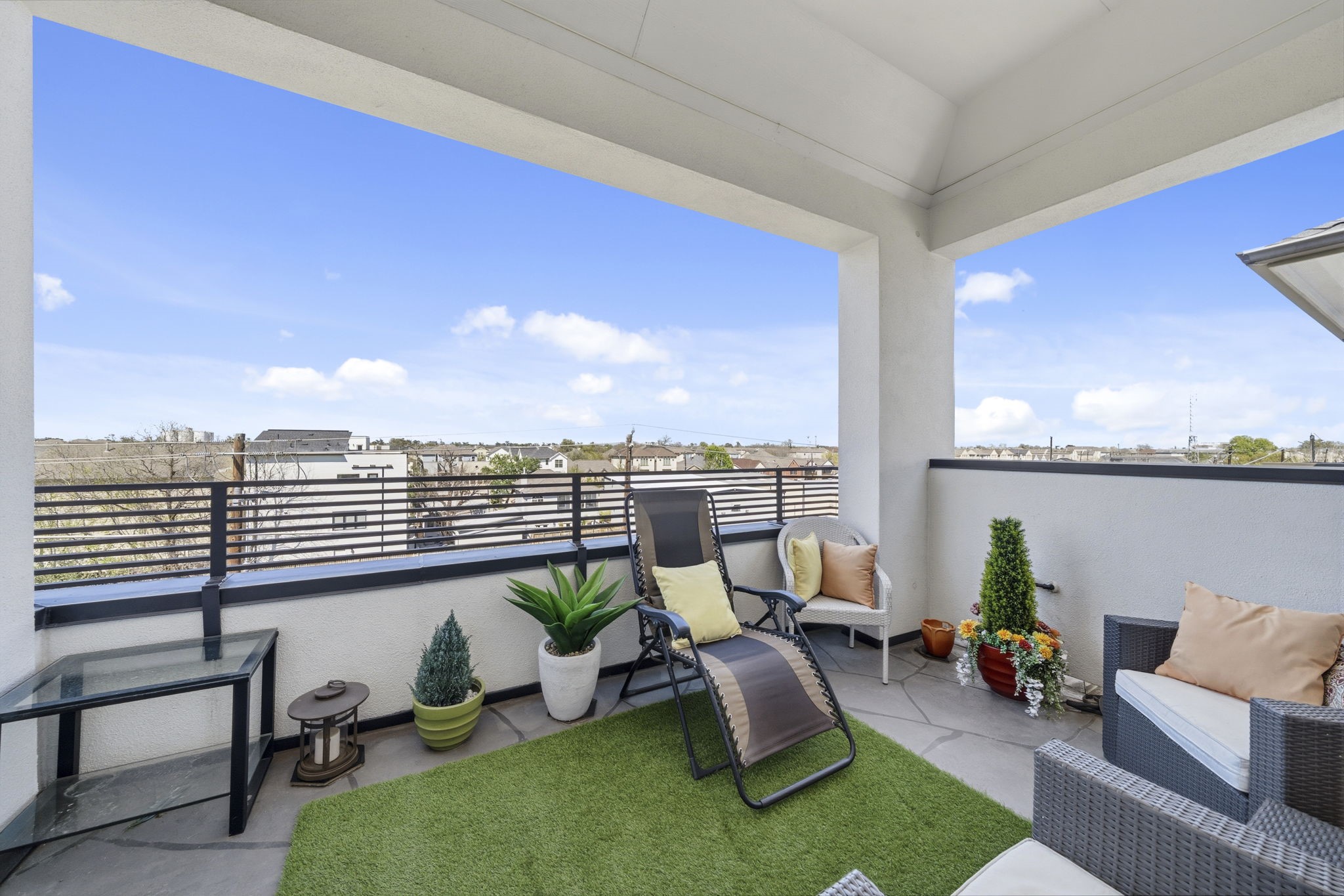 5467 Larkin Street Houston, TX 77007 - Photo 27 of 33 a roof deck with couches and potted plants