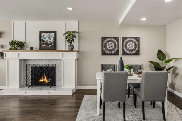 a dining room with furniture and a fireplace