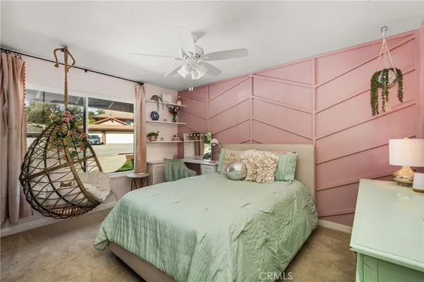 a bedroom with a bed and a chair