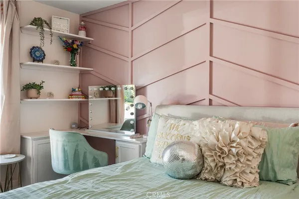 a bathroom with a sink vanity mirror and toilet
