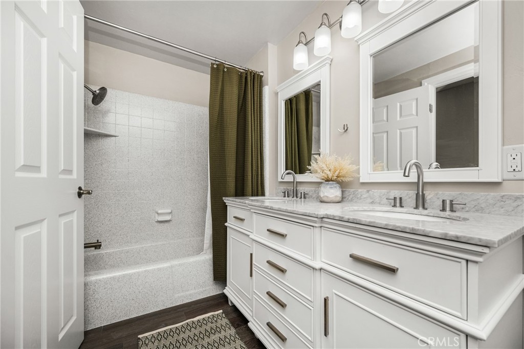688 Buttonwood Drive Brea, CA 92821 - Photo 37 of 54 a bathroom with a granite countertop sink mirror and a bathtub