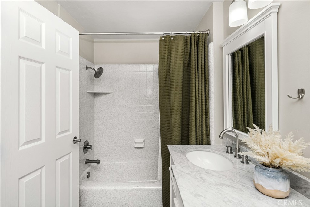 688 Buttonwood Drive Brea, CA 92821 - Photo 38 of 54 a bathroom with a granite countertop tub and a sink