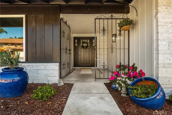 a view of a porch with potted plants