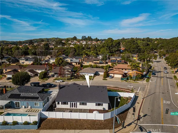 an aerial view of residential building and ocean