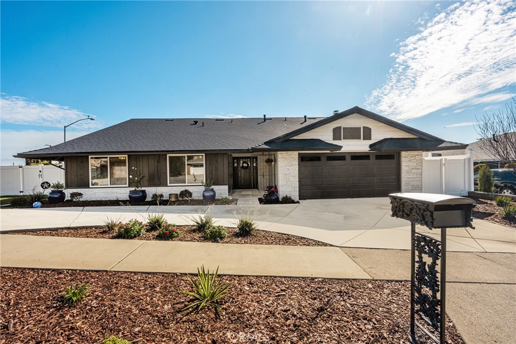 688 Buttonwood Drive Brea, CA 92821 - Photo 53 of 54 a front view of a house with a yard and garage