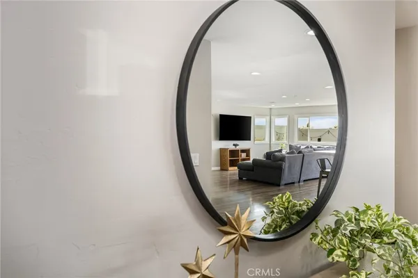 a view of a livingroom with furniture and mirror