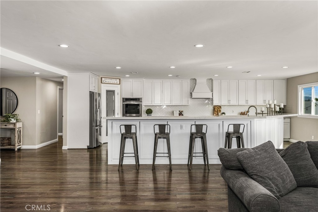 688 Buttonwood Drive Brea, CA 92821 - Photo 7 of 54 a living room with stainless steel appliances kitchen island furniture and wooden floor