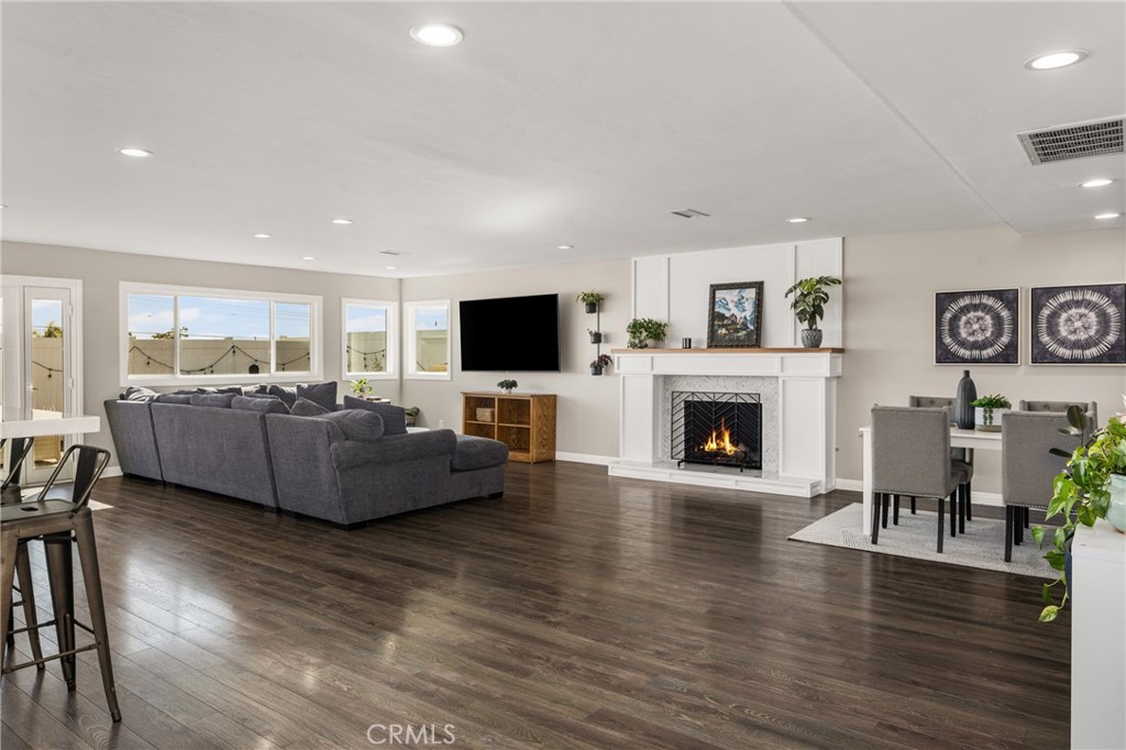 688 Buttonwood Drive Brea, CA 92821 - Photo 10 of 54 a living room with furniture a fireplace and a flat screen tv
