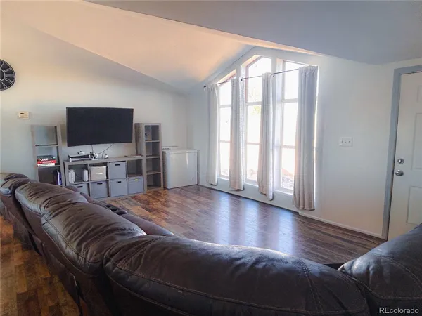 a living room with a couch and a flat screen tv