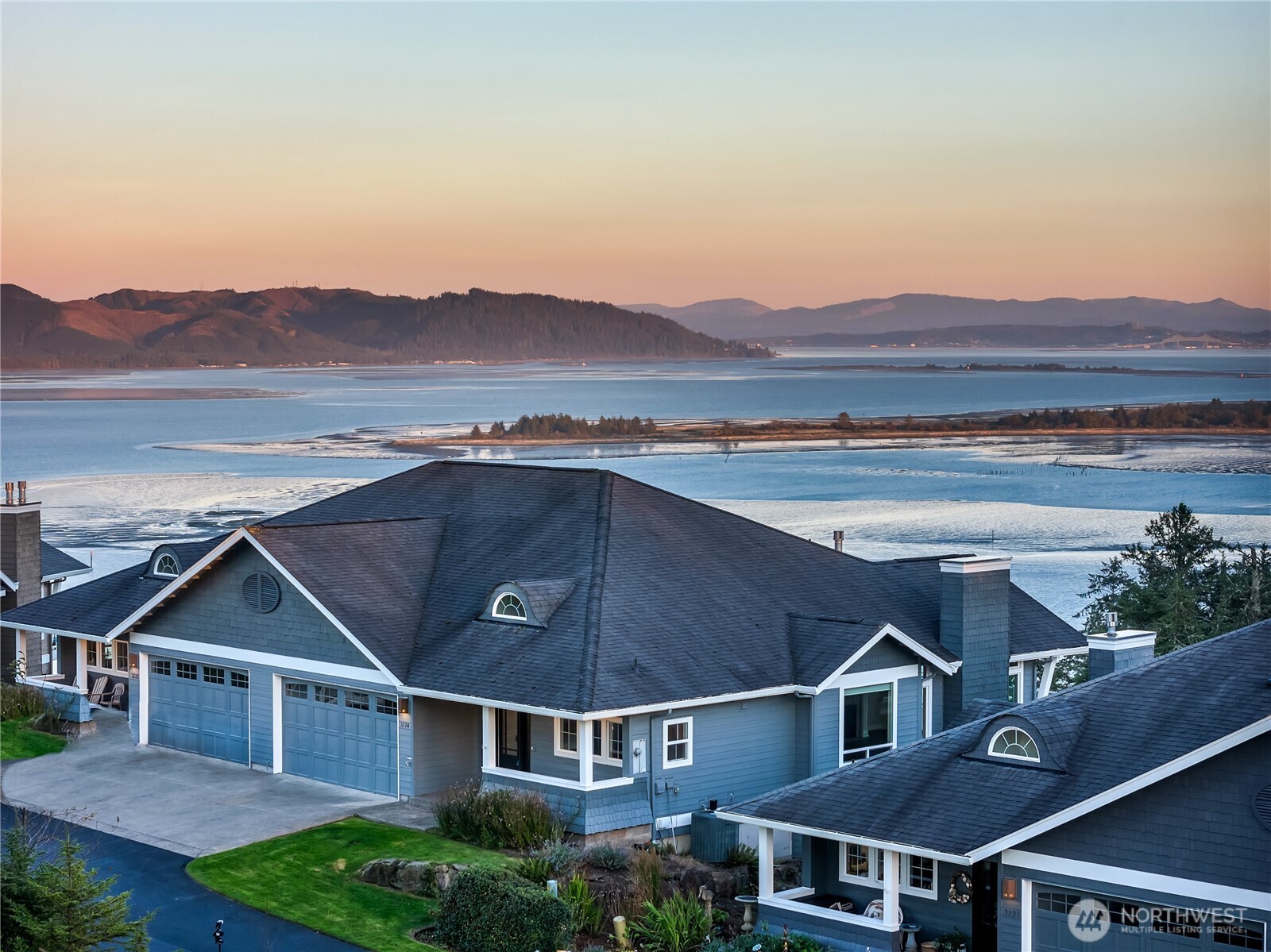 3224 Overlook Loop Ilwaco, WA 98624 - Photo 36 of 38 a view of a big house with a big yard and large tree