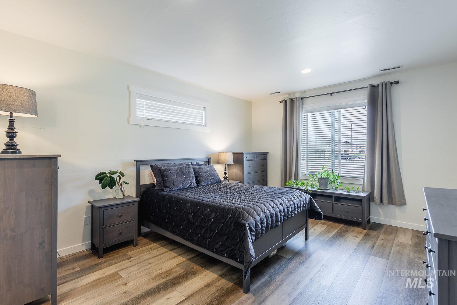 1332 West Raelin Drive Nampa, ID 83686 - Photo 22 of 48 Bedroom featuring hardwood / wood-style flooring and baseboards