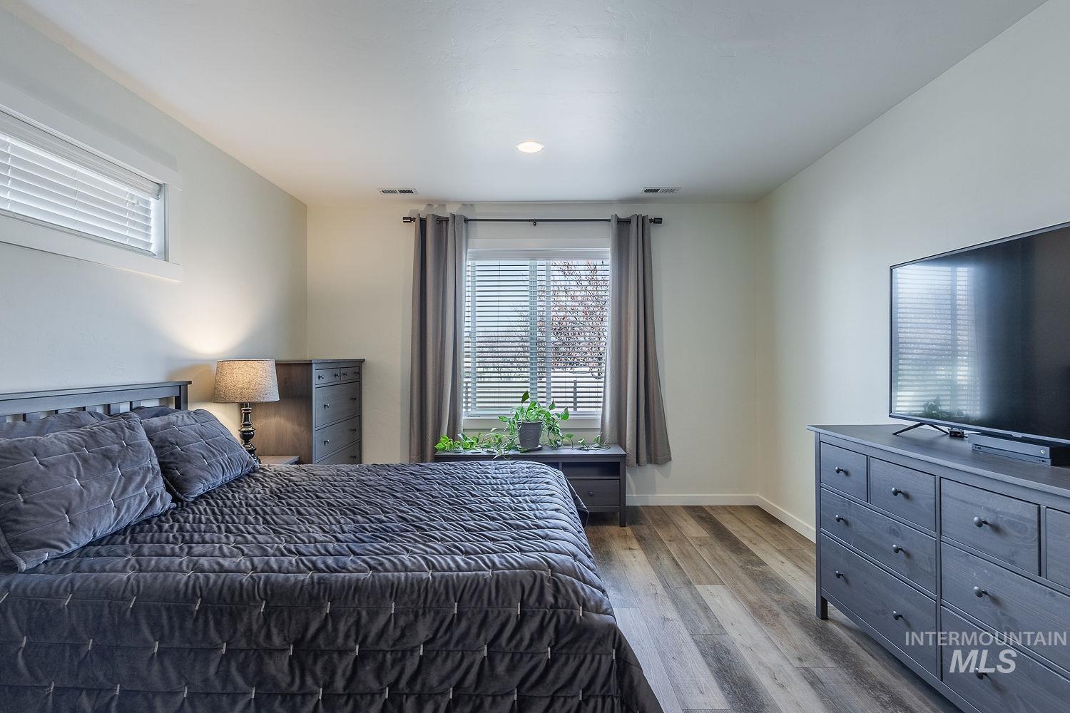 1332 West Raelin Drive Nampa, ID 83686 - Photo 23 of 48 Bedroom featuring light wood-type flooring and baseboards