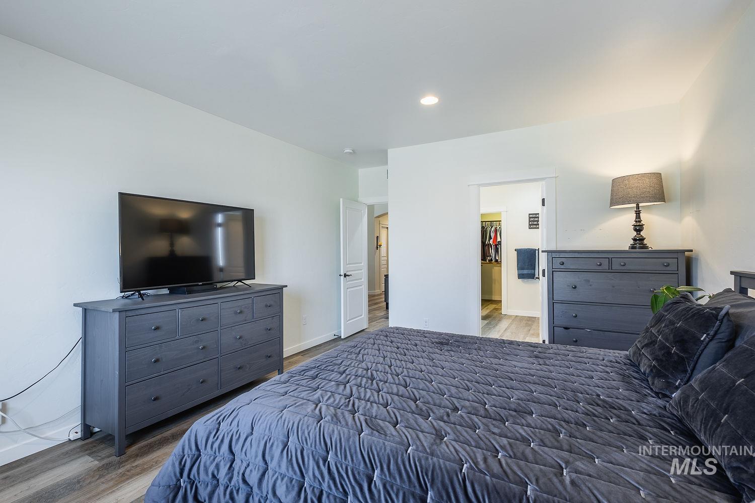 1332 West Raelin Drive Nampa, ID 83686 - Photo 25 of 48 Bedroom with light wood-style flooring, a spacious closet, and recessed lighting